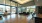 Large well lit lobby with a pool view