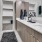 Spacious modern bathroom with large closet and walk in shower at The Drake