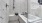 Spacious walk in tub and shower combo with wall stool in apartment homes at The Drake