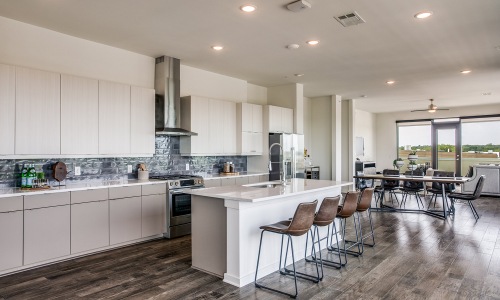 Modern open concept kitchen in penthouse at The Drake